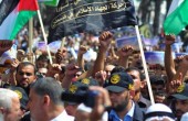الآلاف يشاركون بمسيرة الجهاد وحماس 