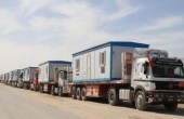 AA-20250218-37091831-37091800-CONTAINER_HOUSES_AND_CONSTRUCTION_EQUIPMENT_WAIT_AT_RAFAH_BORDER_CROSSING_TO_ENTER_GAZA.jpg