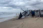 tents damaged gaza sea.jpg