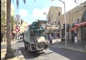 مستوطنون يتجولون بأسلحتهم بحرية كاملة في حي العرقتنجي بيافا القديمة - أماني عثمان - 18 - 9 - 2016