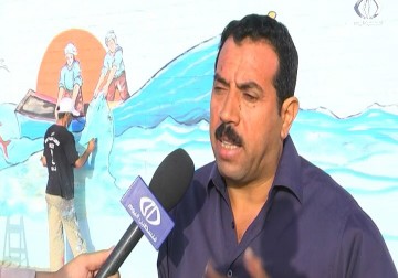 فنانون من غزة يرسمون اطول جدارية متكاملة تخلص واقع الحياة الغزية - رمزي البيروتي - 14 - 6 - 2016