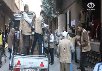 الهئية الخيرية لإغاثة الشعب الفلسطيني توزع حوالي 1000 طرد غذائي - 10 - 12 - 2014 - رنا بجيرمي