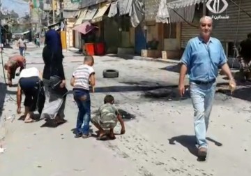 هدوء حذر يسود مخيم عين الحلوة جنوب لبنان والأهالي بدأوا بالعودة لمنازلهم  - 23 - 8 - 2015 - فاطمة عبد الجواد