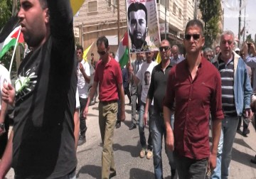 حركة فتح تنظم مسيرة واعتصاما تضامنيا مع الأسير المضرب عن الطعام سامي الجنازرة في الخليل - 9 - 5 - 2016