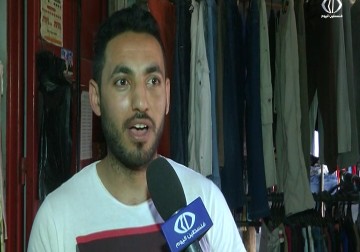 ملابس مستخدمة تحمل شعارات عنصرية وصور اباحية مصدرها الاحتلال - رمزي ابو جزر - 1 - 6 - 2016