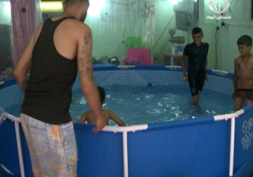 بركة مياه مخصصة للسباحة لأطفال مخيم برج البراجنة في بيروت – 17 – 8 – 2015 - مريم الحاج موسى