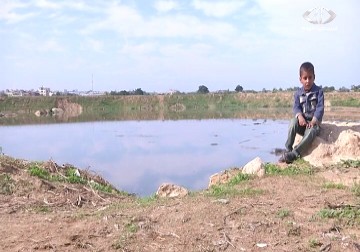 سكان القرية البدوية شمال قطاع  غزة يحذرون من إرتفاع منسوب المياه في أحواض الصرف الصحي - 30 - 11 - 2014 - أكرم دلول