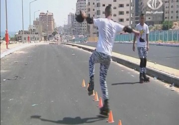 توأمان من غزة ينتعلان أحذية التزلج للتحليق نحو العالمية - 19 - 8 - 2015 - فاطمة عبد الجواد