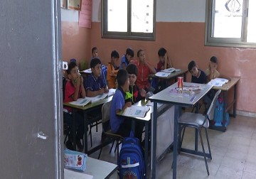 الطفلان أحمد وأمير مسلَّم إلى مقاعد الدراسة التي حرمهما منها العمل والفقر - أمون الشيخ - 4 - 9 - 2016