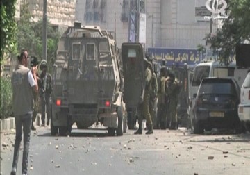 مواجهات مع قوات الاحتلال بعد قمعها مسيرات منددة بجريمة الدوابشة - 31 - 7 - 2015 - فاتن الصالح