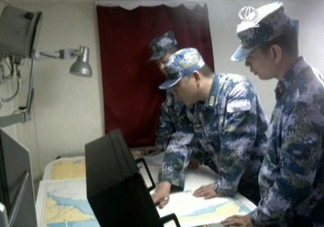 الصين تعلن دخولها الرسمي في عمليات البحث عن الطائرة الماليزية المفقودة - 18 - 3 - 2014 - نادر محمد