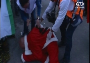 الاحتلال يقمع مسيرة بمناسبة أعياد الميلاد ويعتدي على المشاركين فيها - 23 - 12 - 2014 - حسين مكي