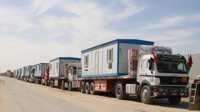 AA-20250218-37091831-37091800-CONTAINER_HOUSES_AND_CONSTRUCTION_EQUIPMENT_WAIT_AT_RAFAH_BORDER_CROSSING_TO_ENTER_GAZA.jpg