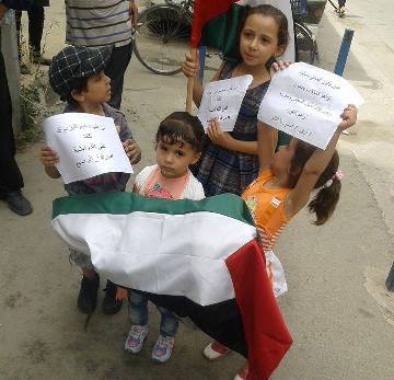 جنازة رمزية للشهيد الرضيع علي دوابشة في مخيم اليرموك